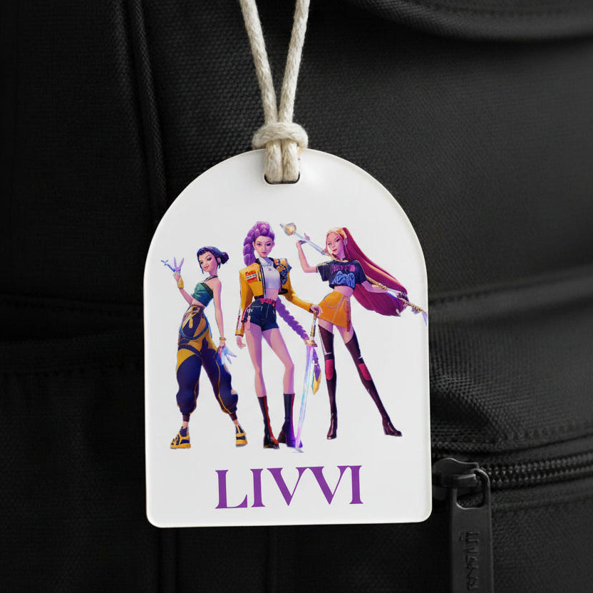 Luggage tag with animated characters and 'LIVVI' branding on a black background
