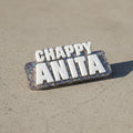 Decorative name badge with 'CHAPPY ANITA' text on a textured gray background
