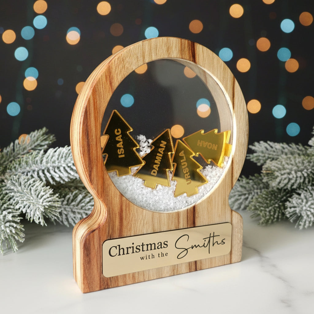Wooden ornament with gold Christmas trees and 'Christmas with the Smiths' text on a wooden background
