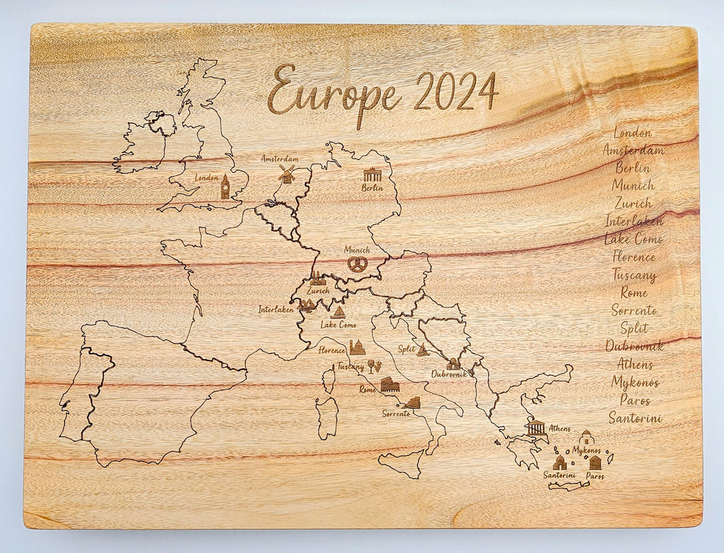 Wooden cutting board with engraved map of Europe and 'Europe 2024' text.