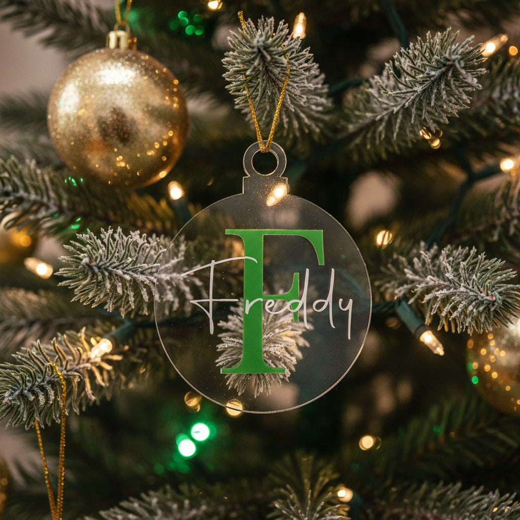 Circular Christmas ornament with 'Freddy' branding on a textured surface