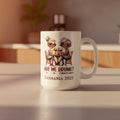 White mug with cartoon design and text on a light gray background