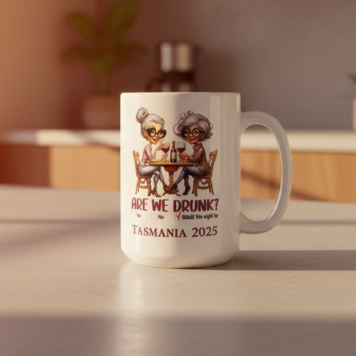 White mug with cartoon design and text on a light gray background