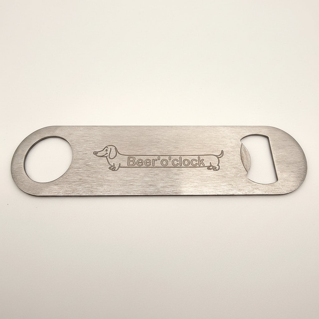 Metal bottle opener with 'Beer o' clock' text and dachshund logo on a white background