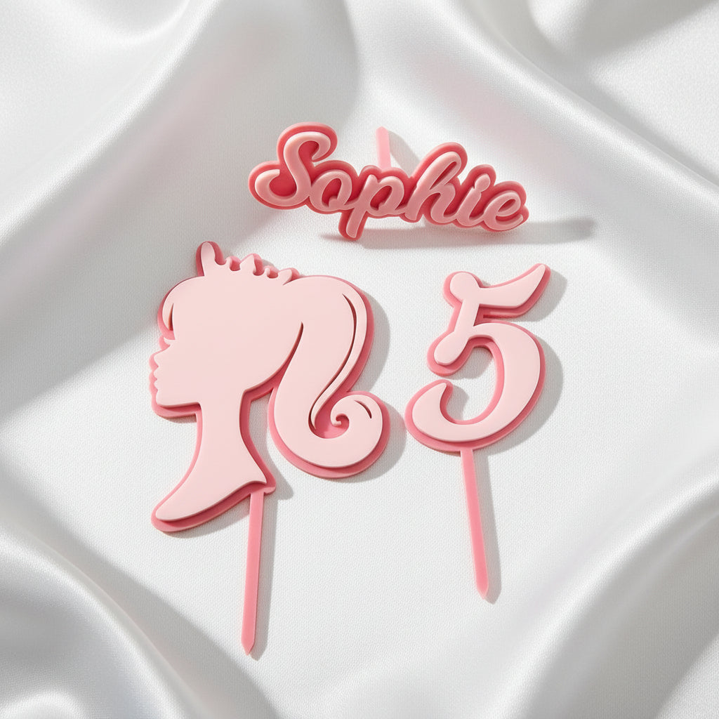 Pink cake topper with a girl's face and the number 5 on a white background