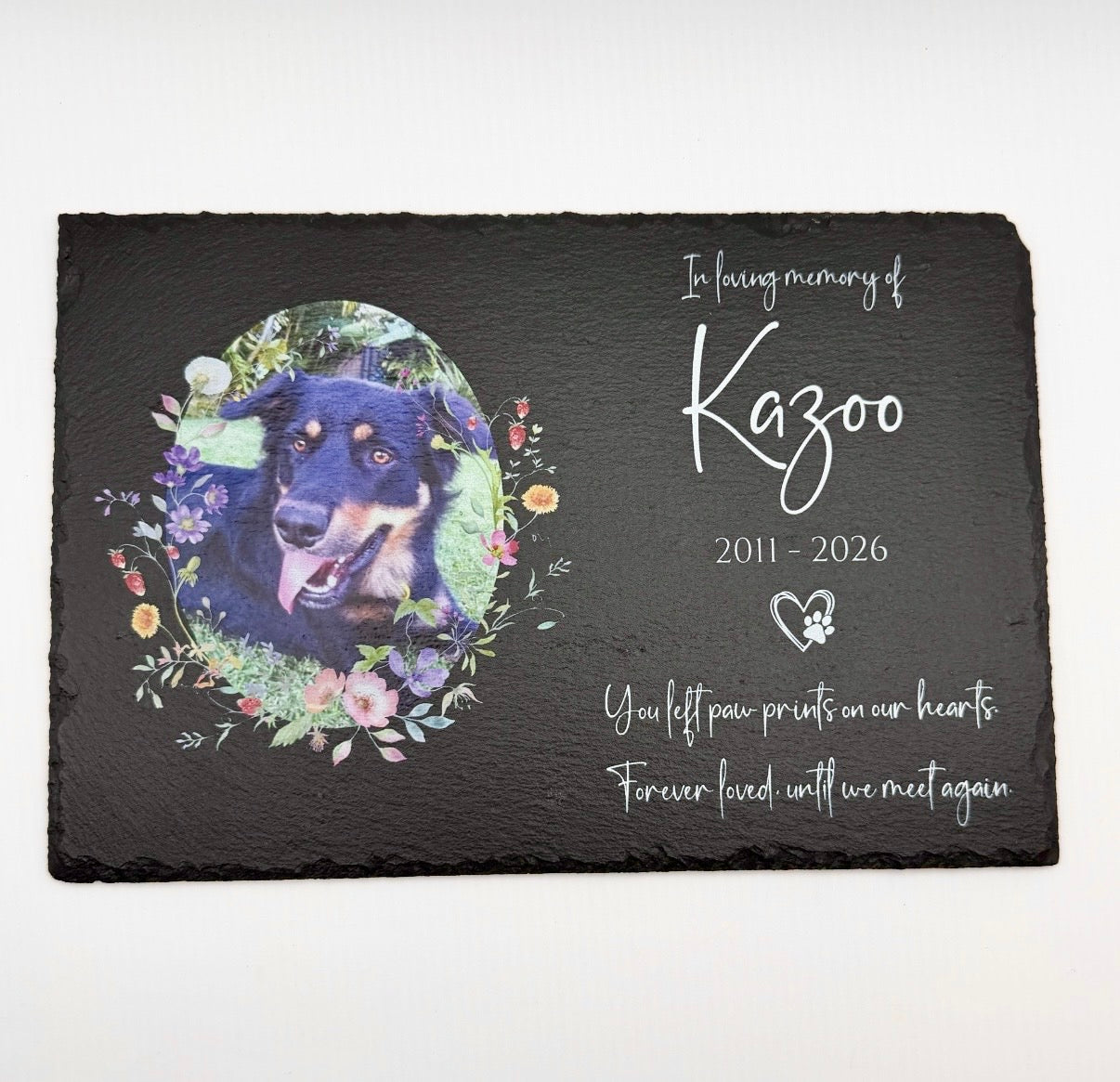 Memorial slate with a dog's portrait and personalized text on a white background