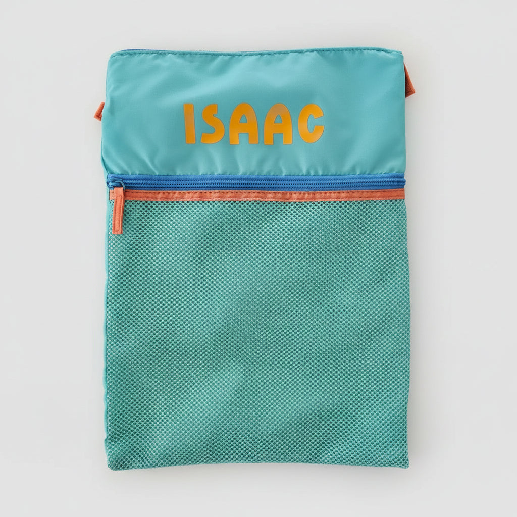 Teal mesh pouch with orange zipper and 'ISAAC' embroidery on a beige background