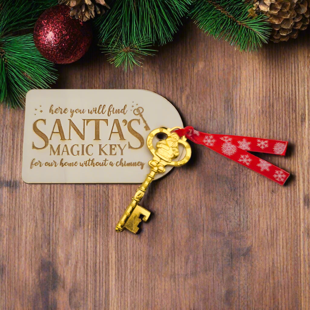 Gold key with red ribbon on a white background