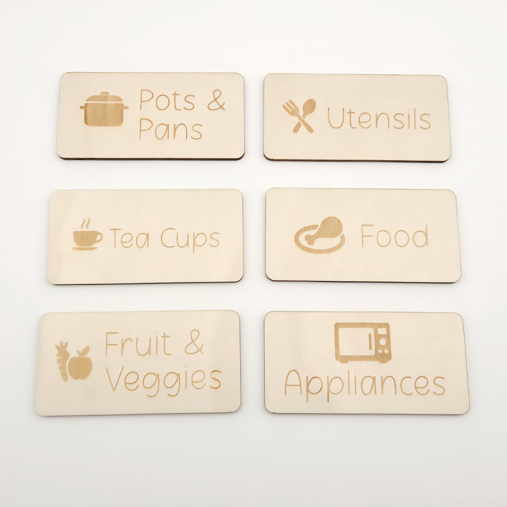 Set of six wooden labels with kitchen-themed icons and text on a white background