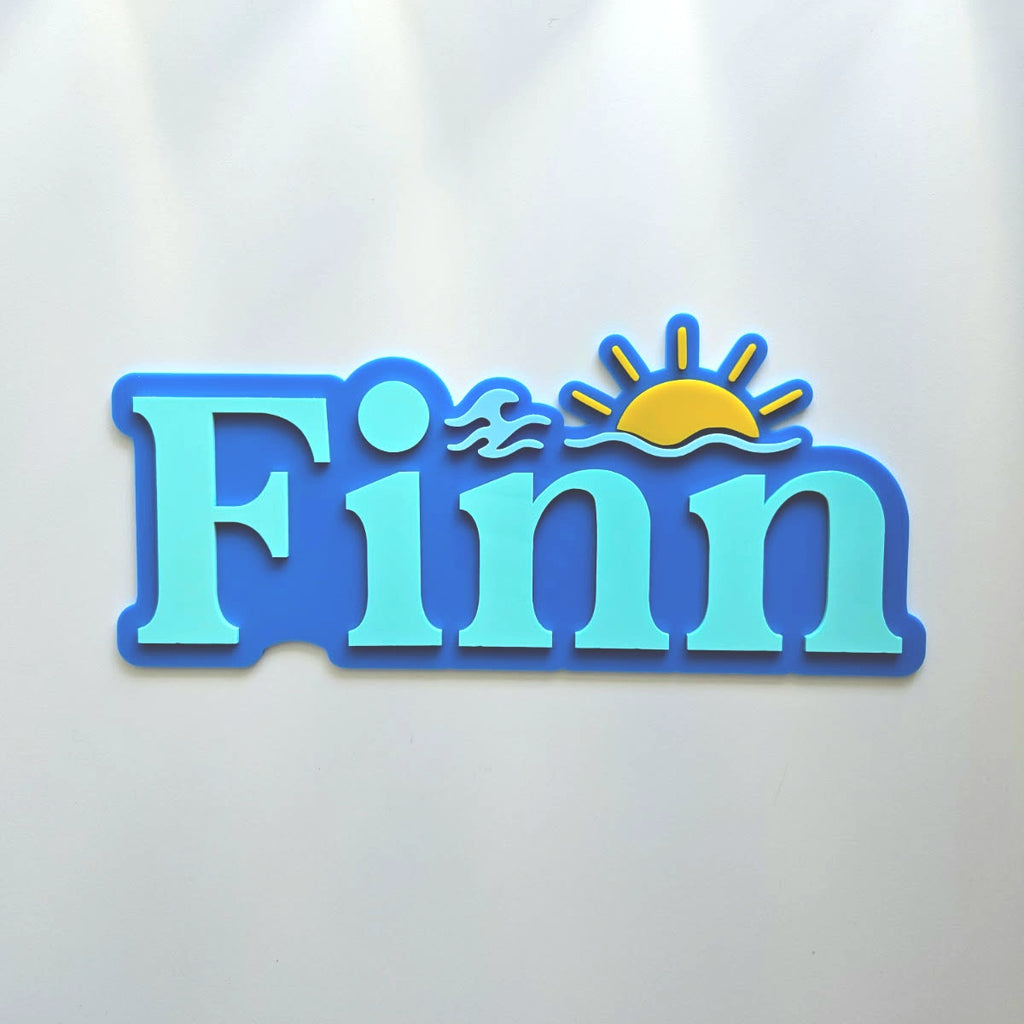Sticker with the name 'Finn' and decorative elements on a light gray background