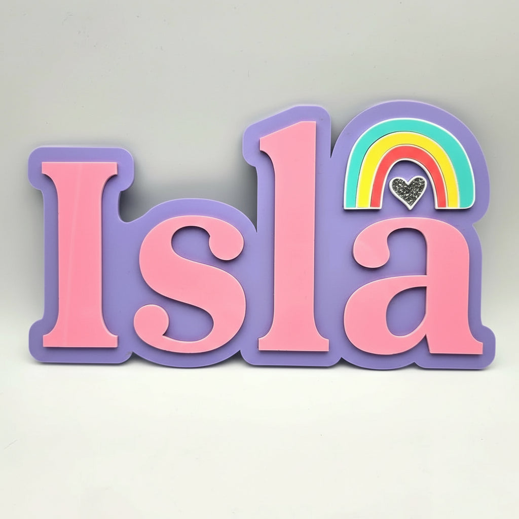 Decorative name 'Isla' with a rainbow and heart on a light gray background
