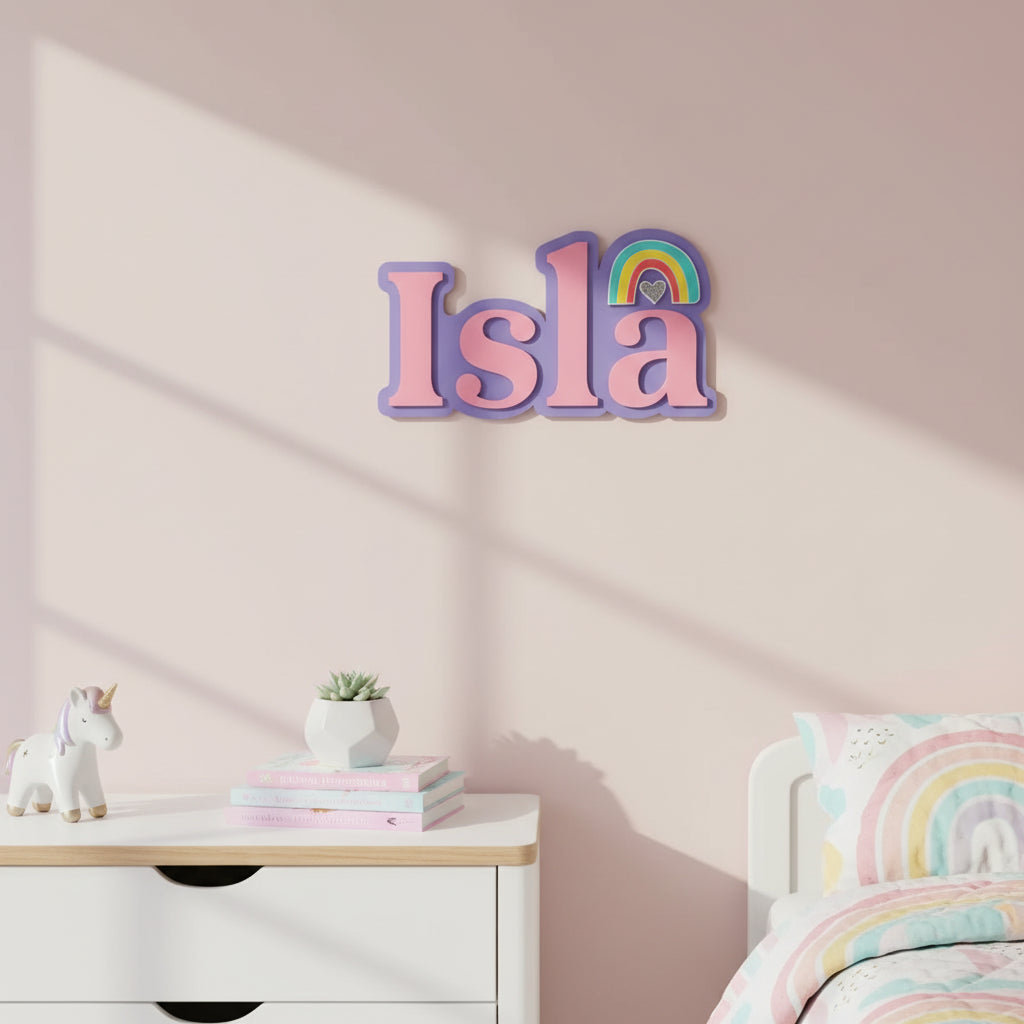 Decorative name 'Isla' with a rainbow and heart on a light gray background