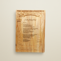 Wooden plaque with engraved text on a background