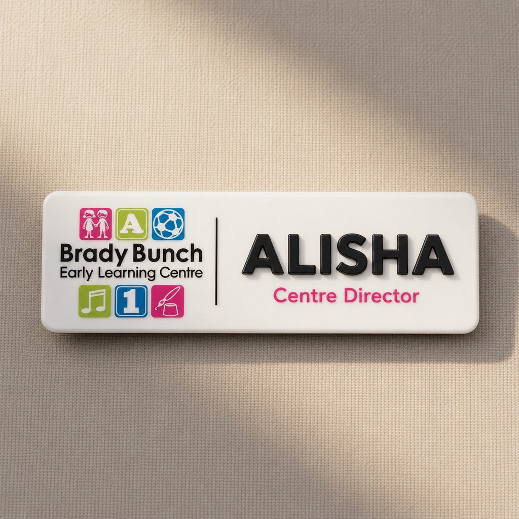 Personalised childcare centre acrylic name badge with Brady Bunch Early Learning Centre logo and Alisha Centre Director text