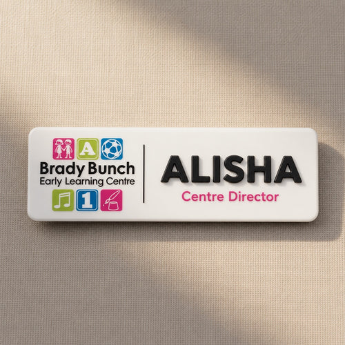 Personalised childcare centre acrylic name badge with Brady Bunch Early Learning Centre logo and Alisha Centre Director text