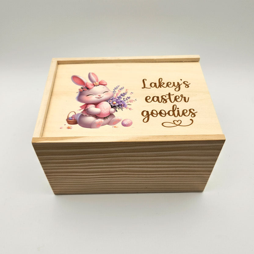 Wooden box with Easter design and text on a white background