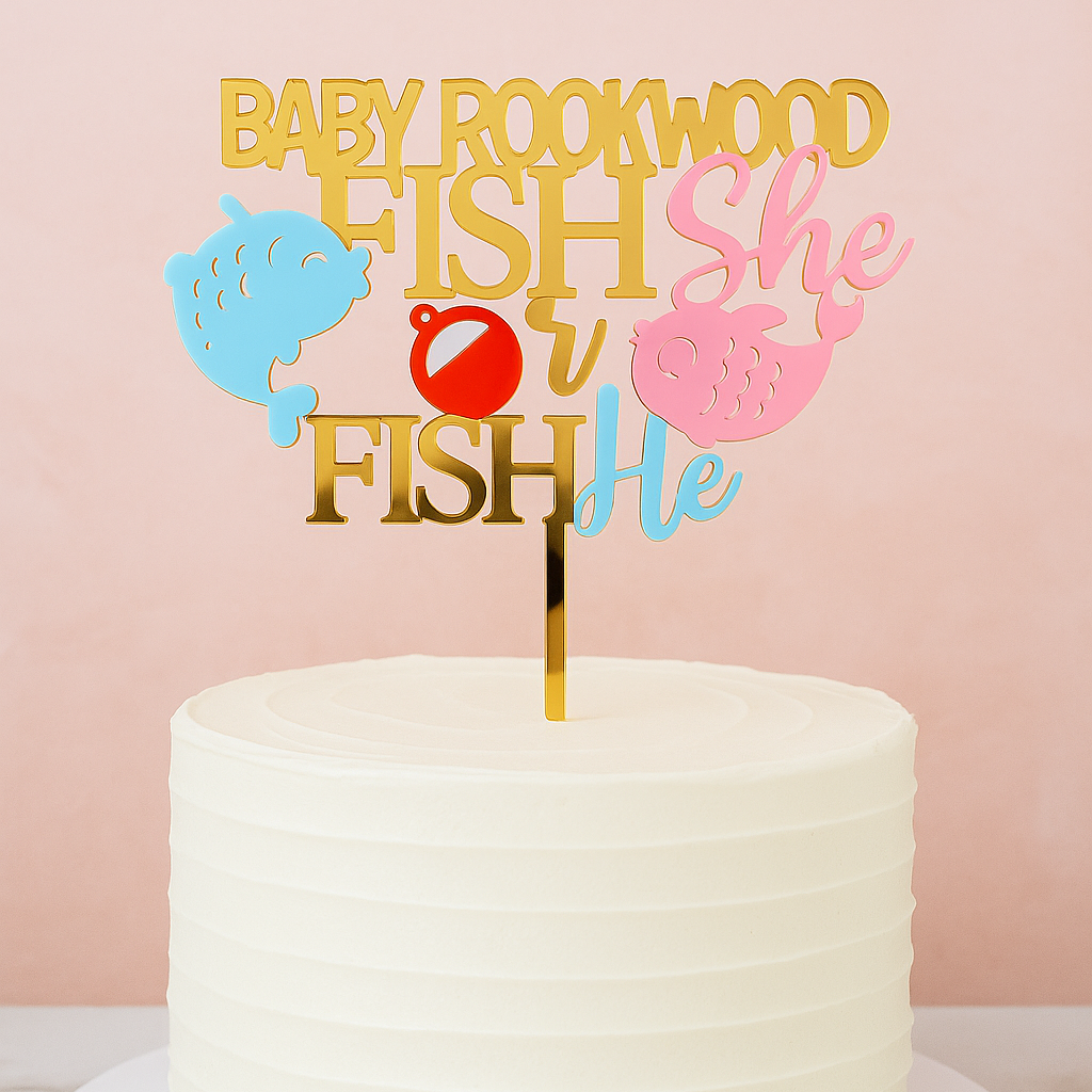 White cake with a gender reveal cake topper on a pink background