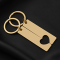 Gold keychain with bottle opener and heart design on a beige background