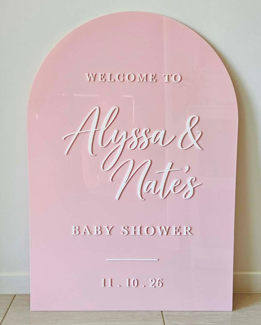 Blush pink arch baby shower sign personalised with names and date