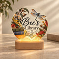 Personalised LED light for her with a custom library design, native flowers, books, bees and a dragonfly