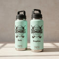 Three YETI brand water bottles with 'Demons Hockey Club' design and names on a white background