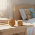 Wooden toy box with 'Kydens' branding on a wooden table in a child's bedroom.
