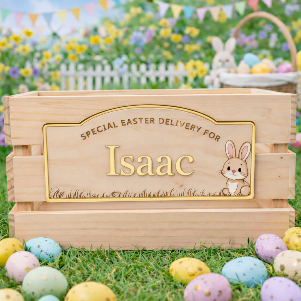 Wooden Easter basket with personalized name plaque in an outdoor setting with Easter eggs and bunnies.