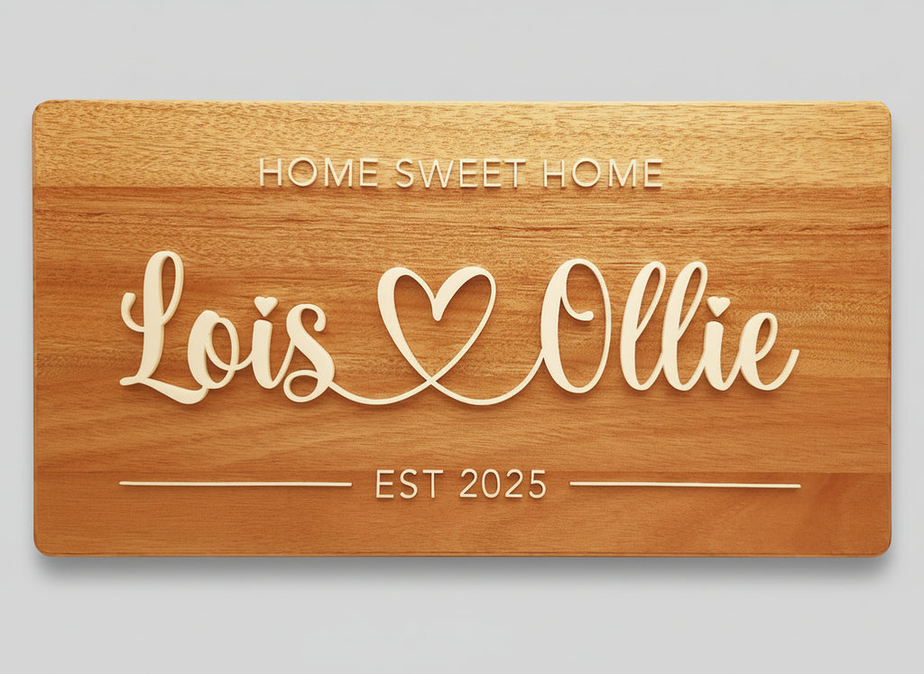Wooden plaque with 'Home Sweet Home' and 'Lois Ollie' engraved on a beige background
